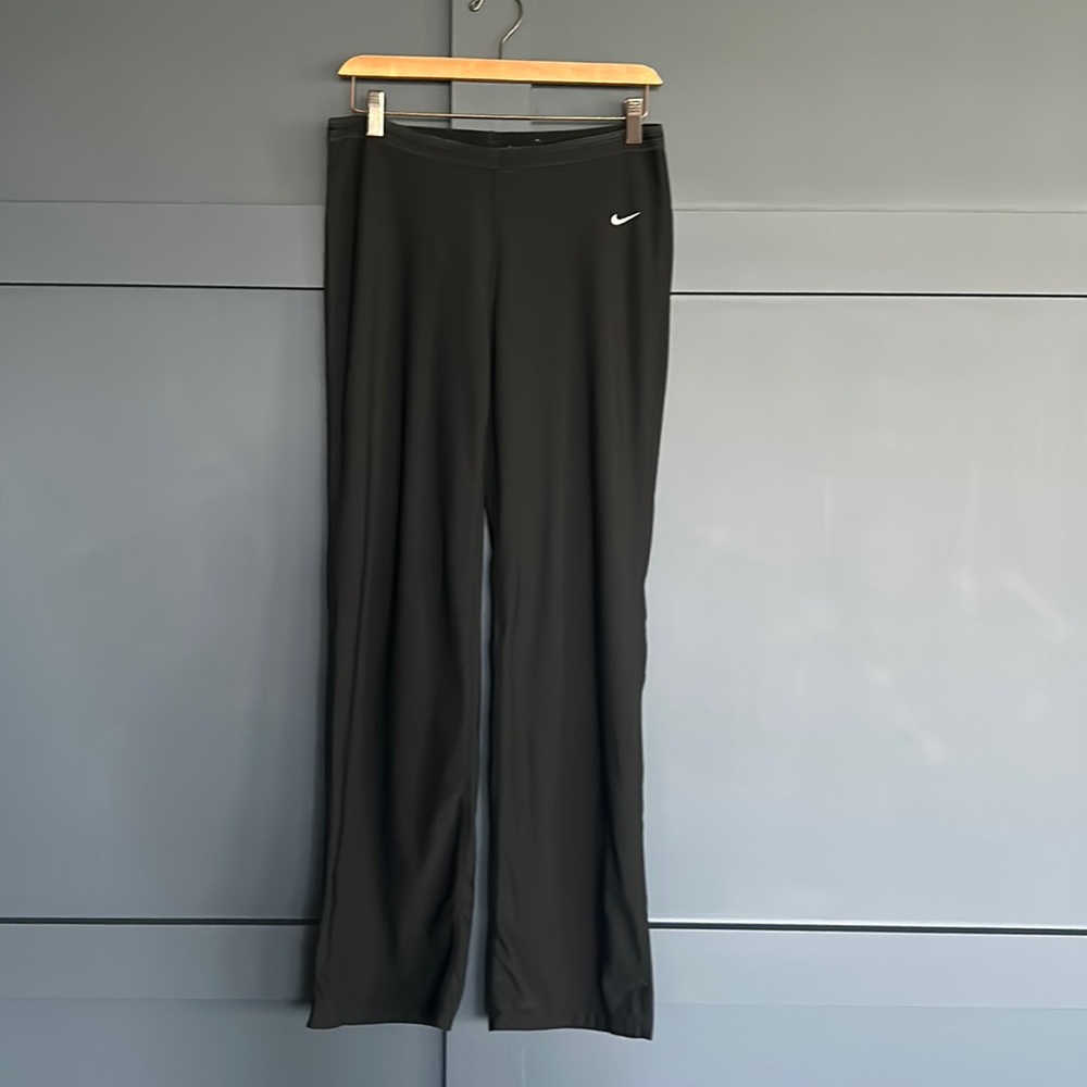 Nike boot cut style black leggings with cute scrunching bow behind the knees.